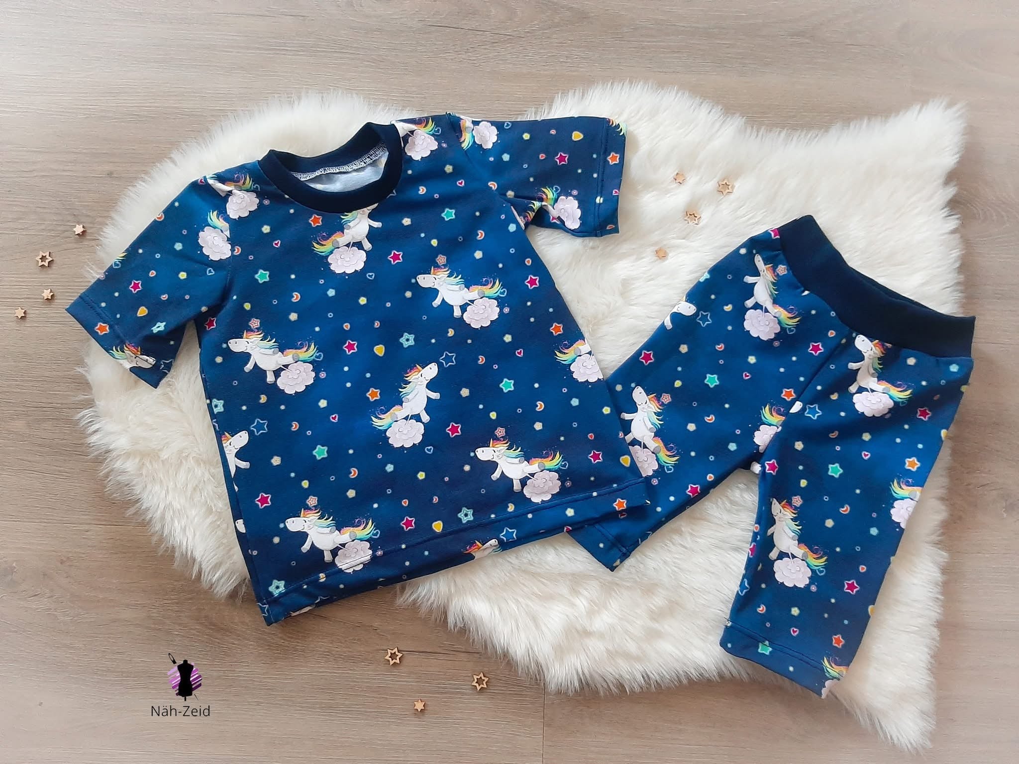 0,5m Bio-Jersey Glitzereinhorn denimblau AOP